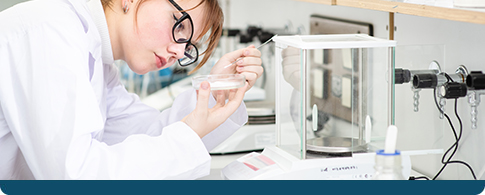 medical researcher working in a laboratory with a precision scale