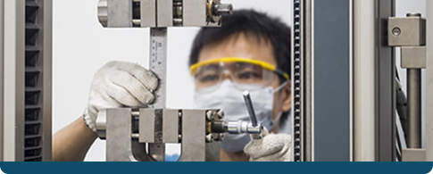 man running a tensile test in a lab