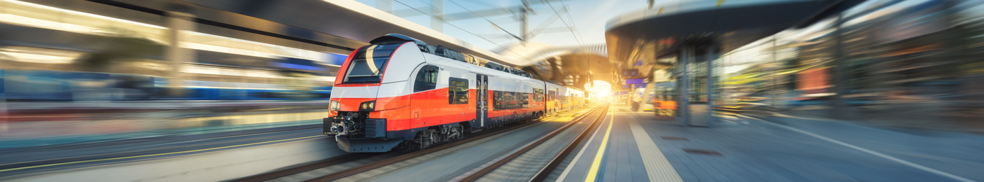 High-speed passenger train moving at railway station platform