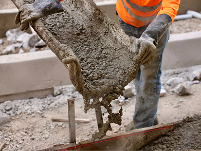 man pouring concrete