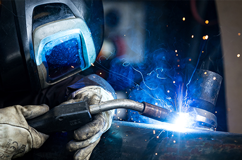 Welding, fabrication, manufacturing industry worker wearing personal protective equipment